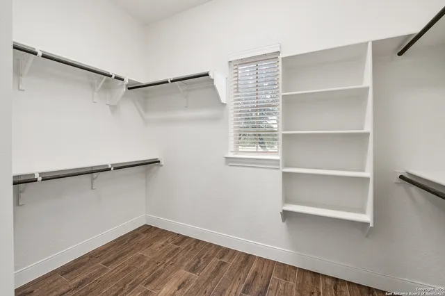 a view of an empty walk in closet