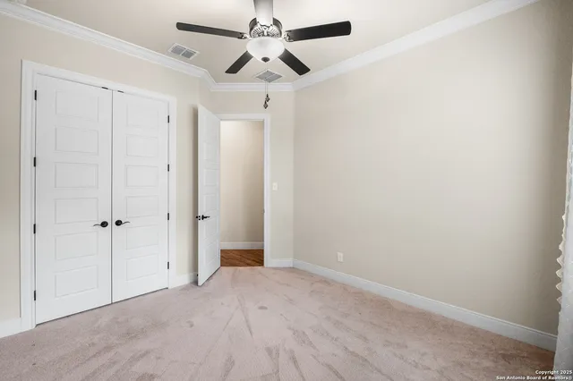 a view of room with a ceiling fan