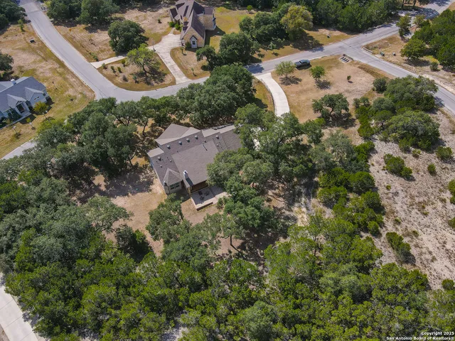 an aerial view of residential house with outdoor space