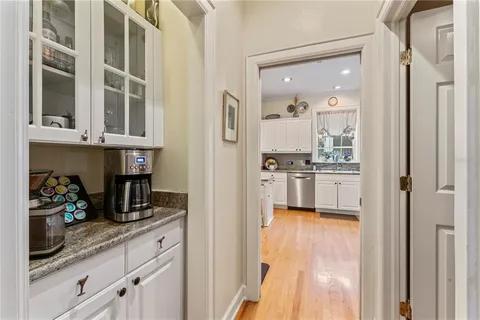 a kitchen with stainless steel appliances granite countertop a refrigerator and cabinets
