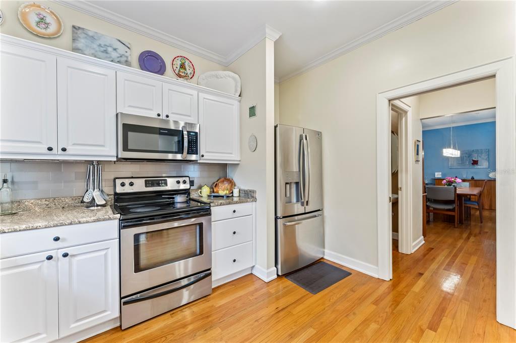 3011 West Mason Street, Unit B Tampa, FL 33629 - Photo 16 of 42 a kitchen with stainless steel appliances granite countertop a refrigerator stove and sink