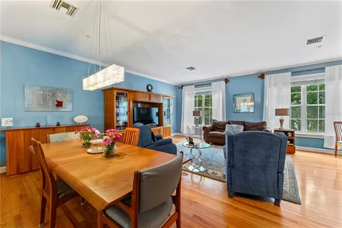 a living room with furniture a table and a window