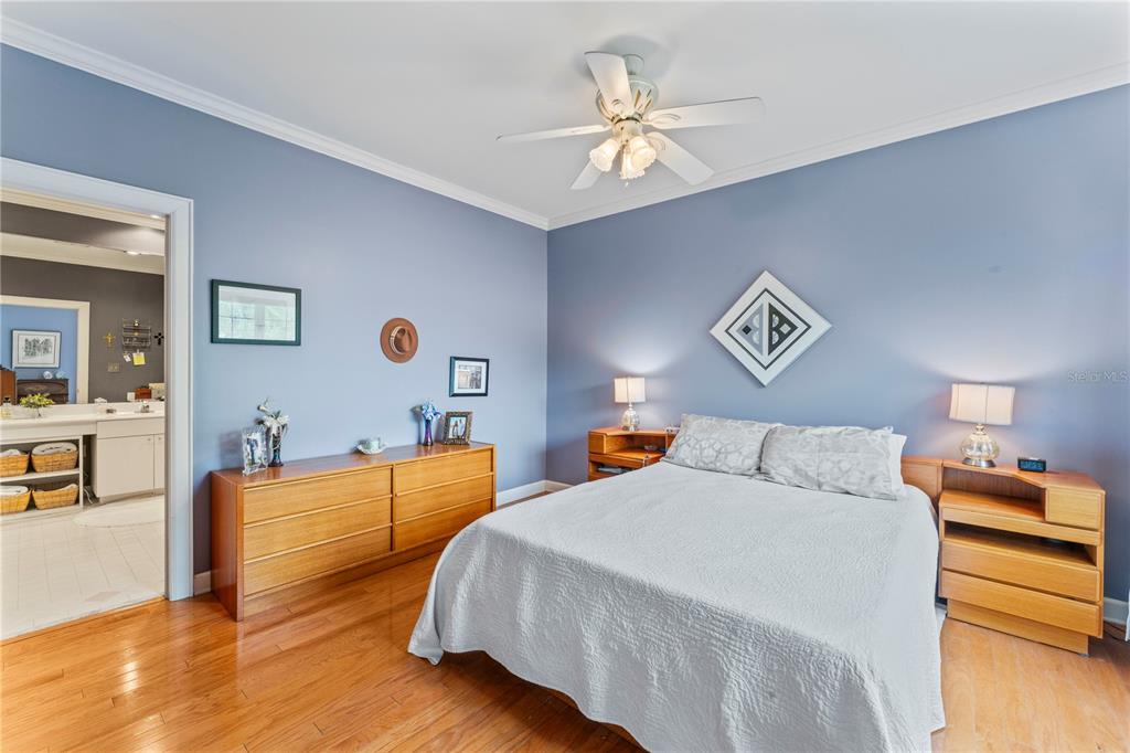 3011 West Mason Street, Unit B Tampa, FL 33629 - Photo 33 of 42 a bedroom with a bed and a chandelier