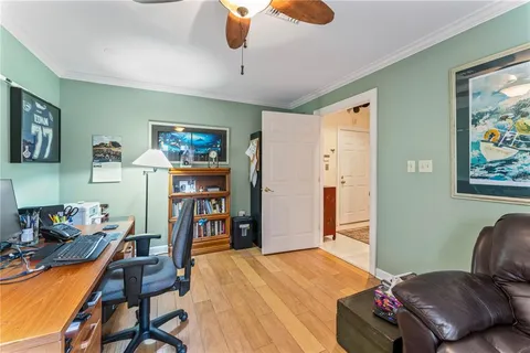 a bedroom with furniture and a flat screen tv