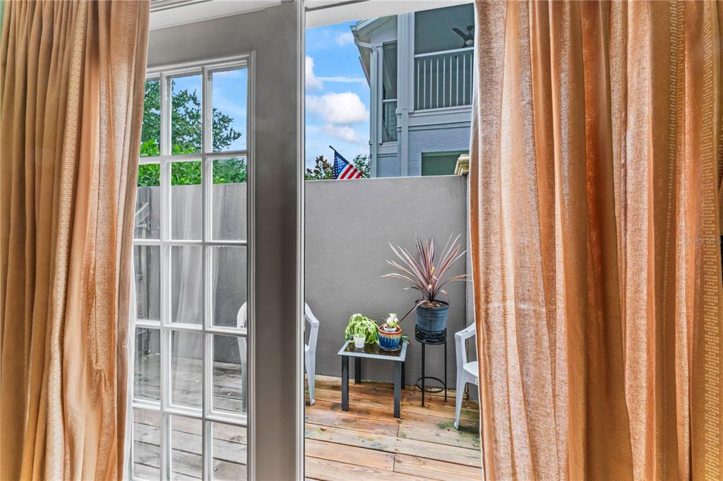 3011 West Mason Street, Unit B Tampa, FL 33629 - Photo 9 of 42 a view of a balcony with a potted plants and floor to ceiling window