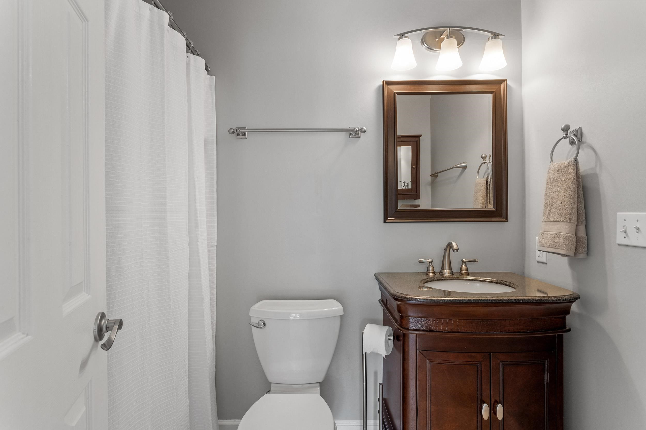 4 Hitching Rack Court Durham, NC 27713 - Photo 31 of 38 a bathroom with a toilet sink and mirror