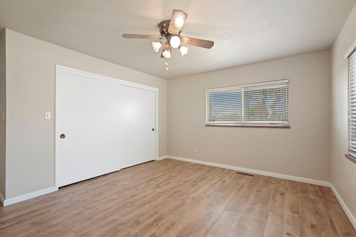 2636 West Turner Road Lodi, CA 95242 - Photo 17 of 24 a view of an empty room with wooden floor