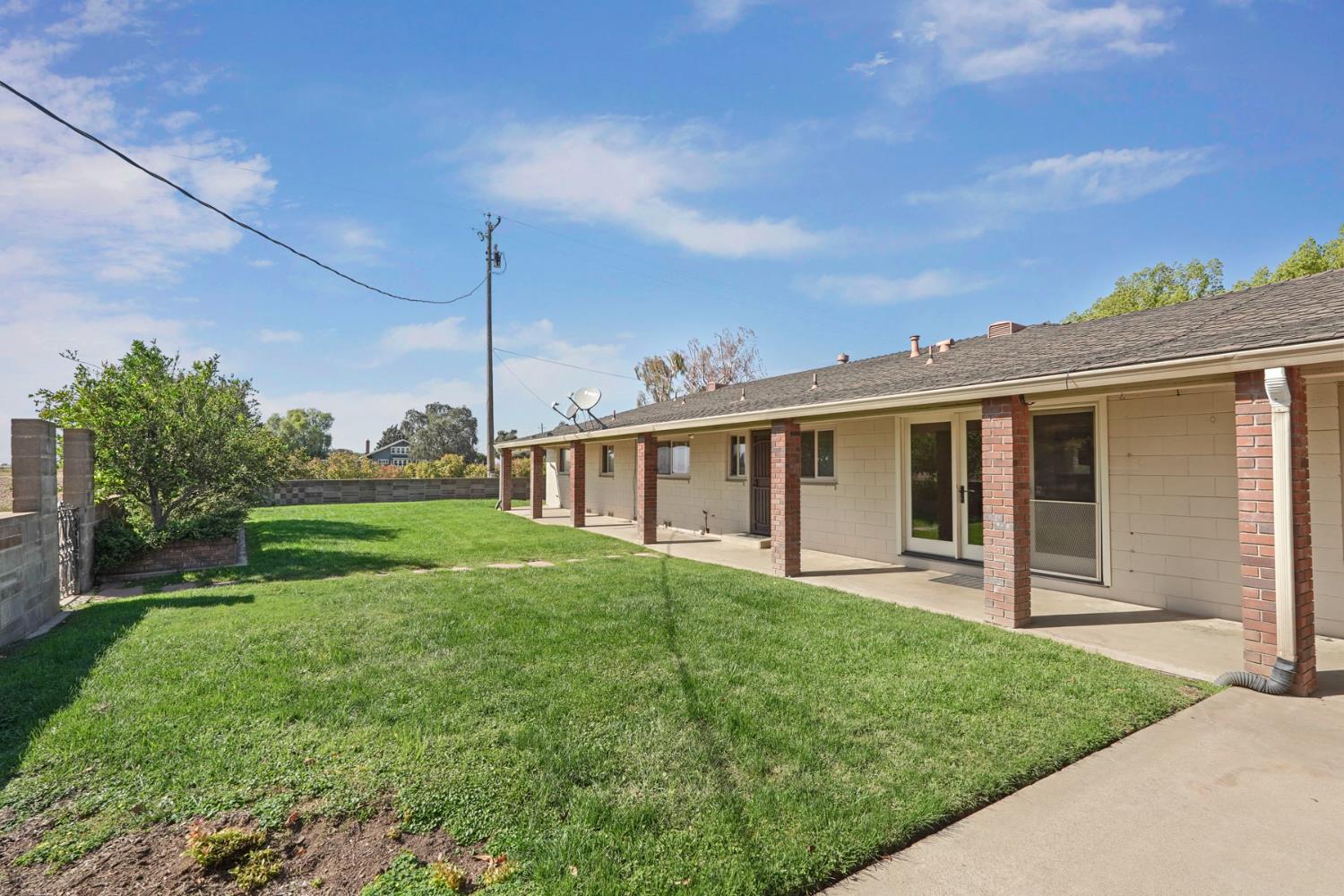 2636 West Turner Road Lodi, CA 95242 - Photo 19 of 24 a view of a house with yard and a garden
