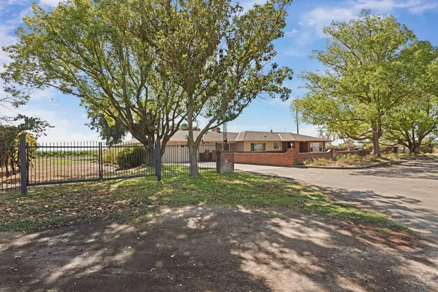 a house with trees in front of it