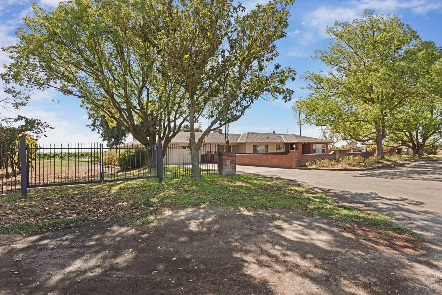 2636 West Turner Road Lodi, CA 95242 - Photo 23 of 24 a house with trees in front of it
