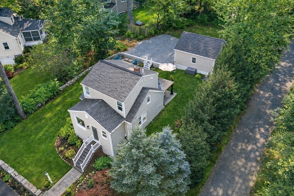 an aerial view of a house with a garden