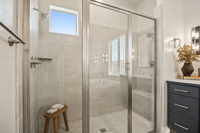 a bathroom with a shower and a sink