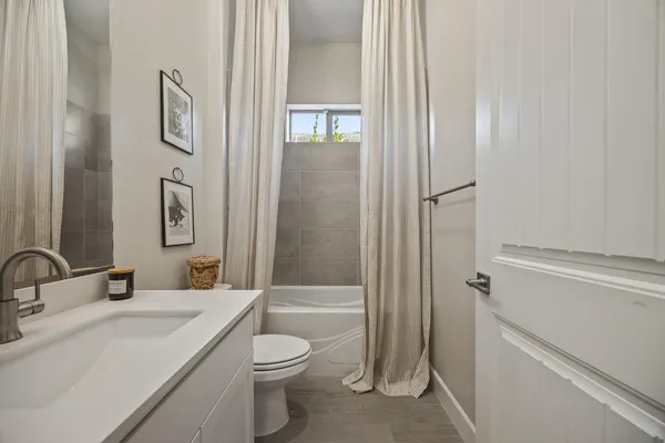 a bathroom with a tub and sink