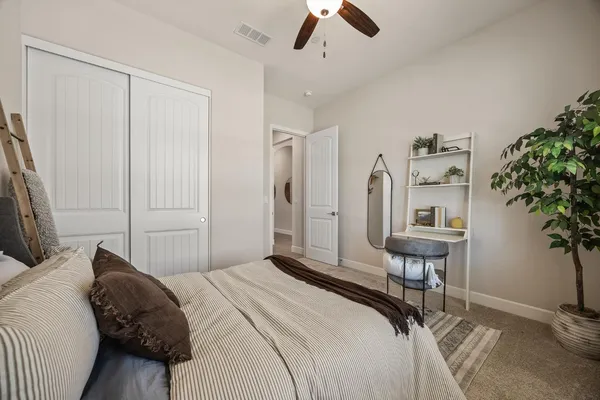 a bathroom with a tub a sink and a large mirror
