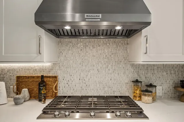 a kitchen with a stove and a microwave