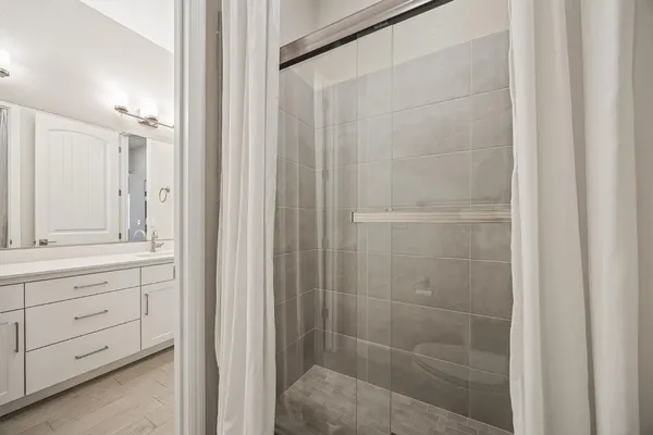 a view of a kitchen with sink and cabinets