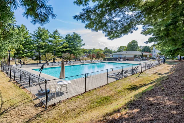 a view of a chair and tables in the patio