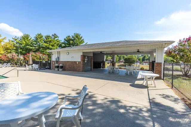 a view of a swimming pool with a patio