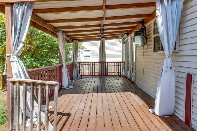 a view of outdoor space with wooden floor and iron stairs