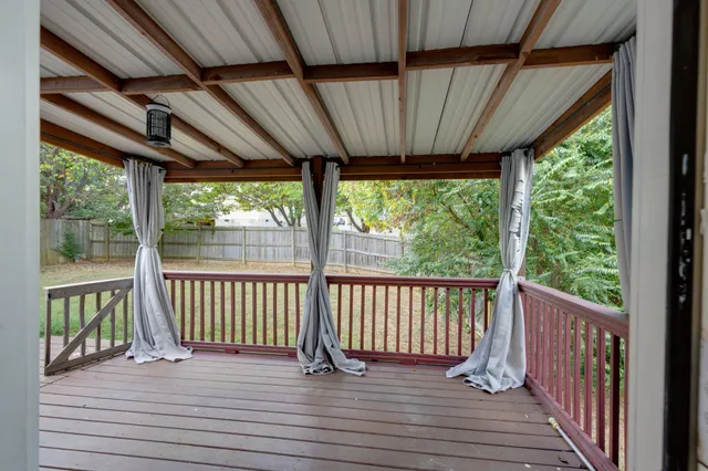a view of a deck with wooden floor and outdoor space