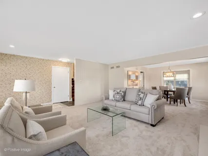 a living room with furniture and a lamp