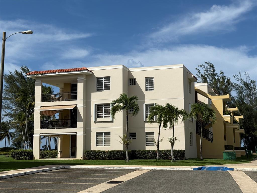 Continental Beach Resorts Continental Beach, Unit A12 Rio Grande, PR 00745 - Photo 1 of 1 front view of a house with a street