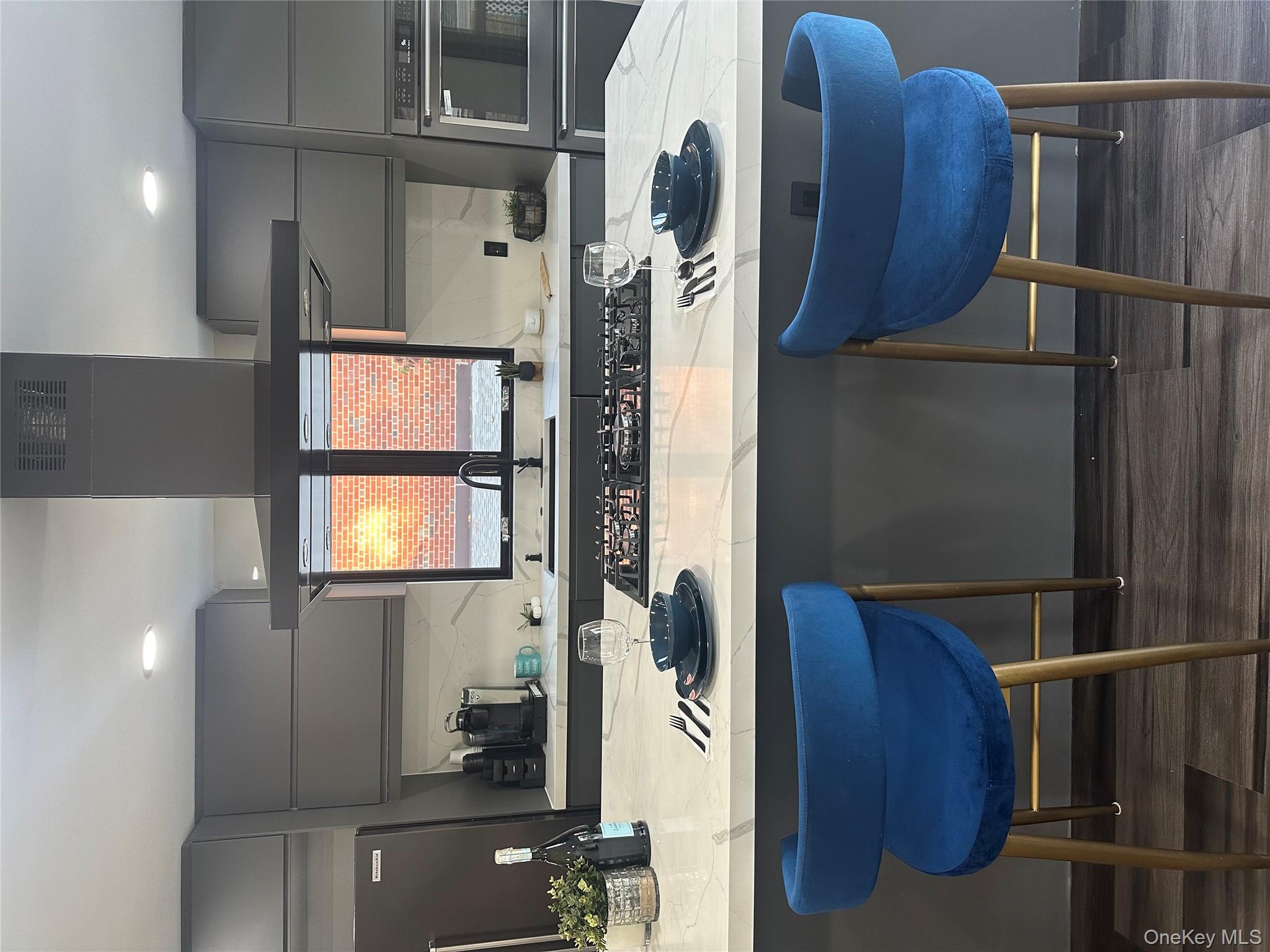 5918 Delafield Avenue Bronx, NY 10471 - Photo 11 of 31 a kitchen with a sink cabinets and wooden floor