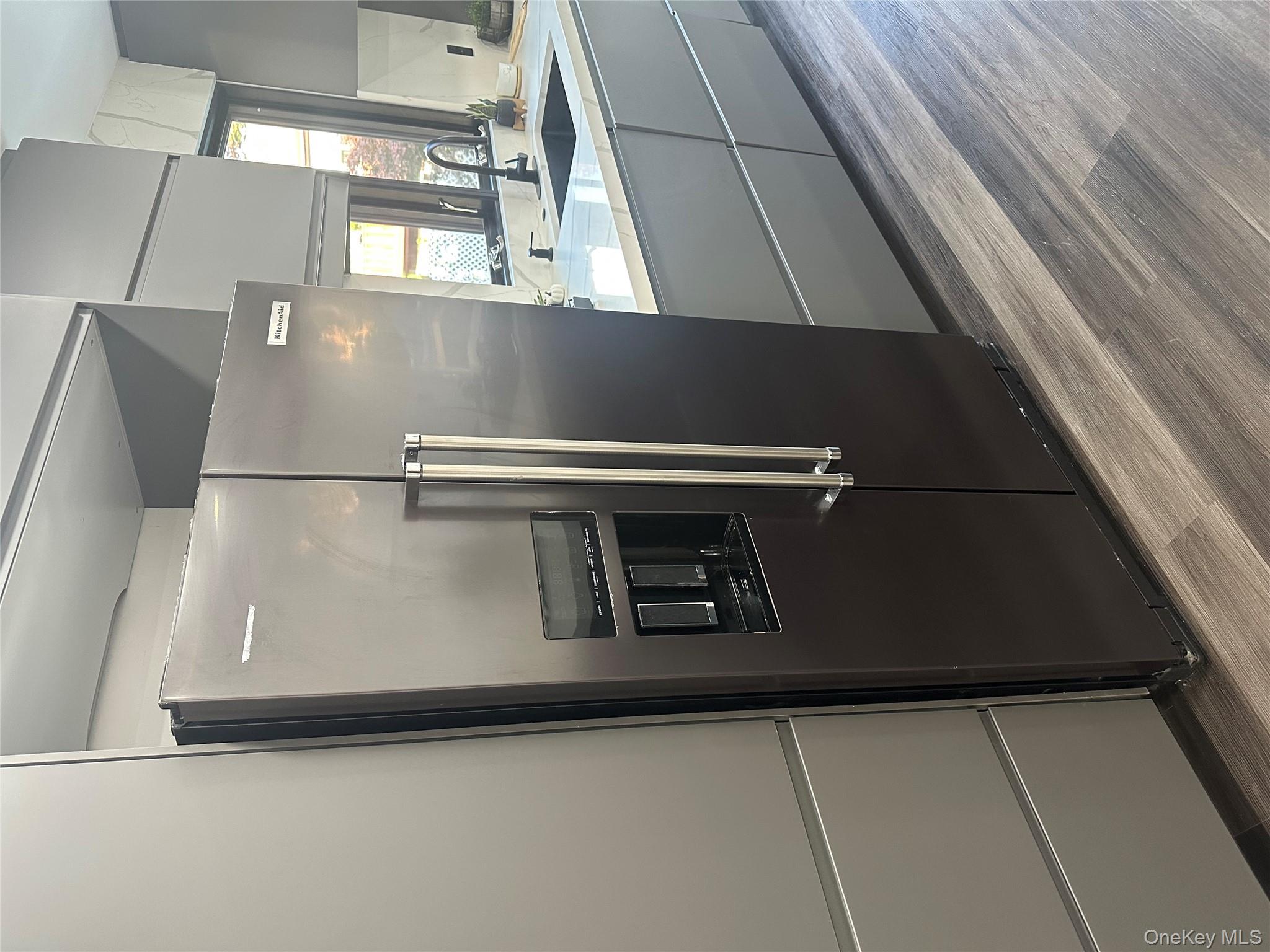 5918 Delafield Avenue Bronx, NY 10471 - Photo 12 of 31 a kitchen with stainless steel appliances granite countertop a refrigerator and a sink