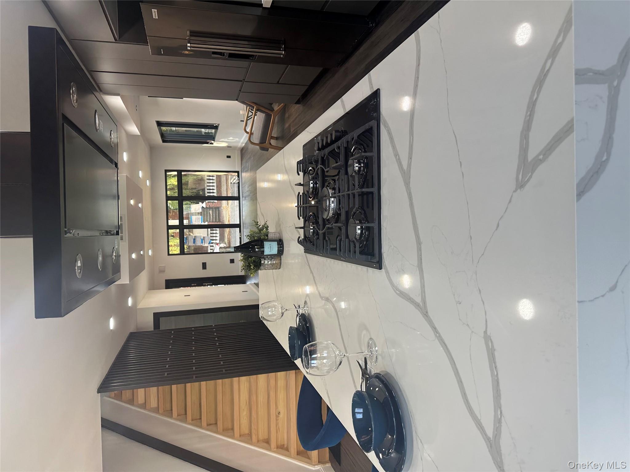 5918 Delafield Avenue Bronx, NY 10471 - Photo 13 of 31 a kitchen with stainless steel appliances granite countertop a sink and a stove