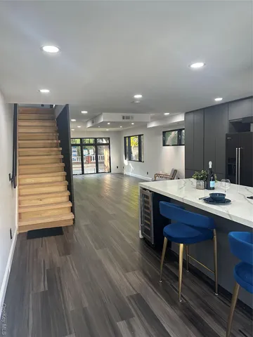 a view of room with window and hardwood floor