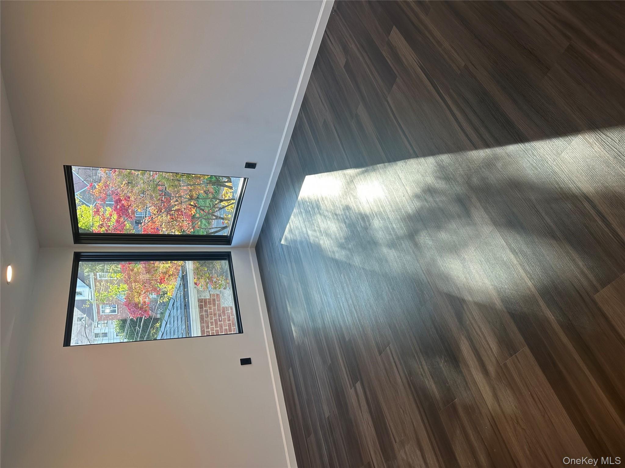 5918 Delafield Avenue Bronx, NY 10471 - Photo 16 of 31 a view of room with window and hardwood floor