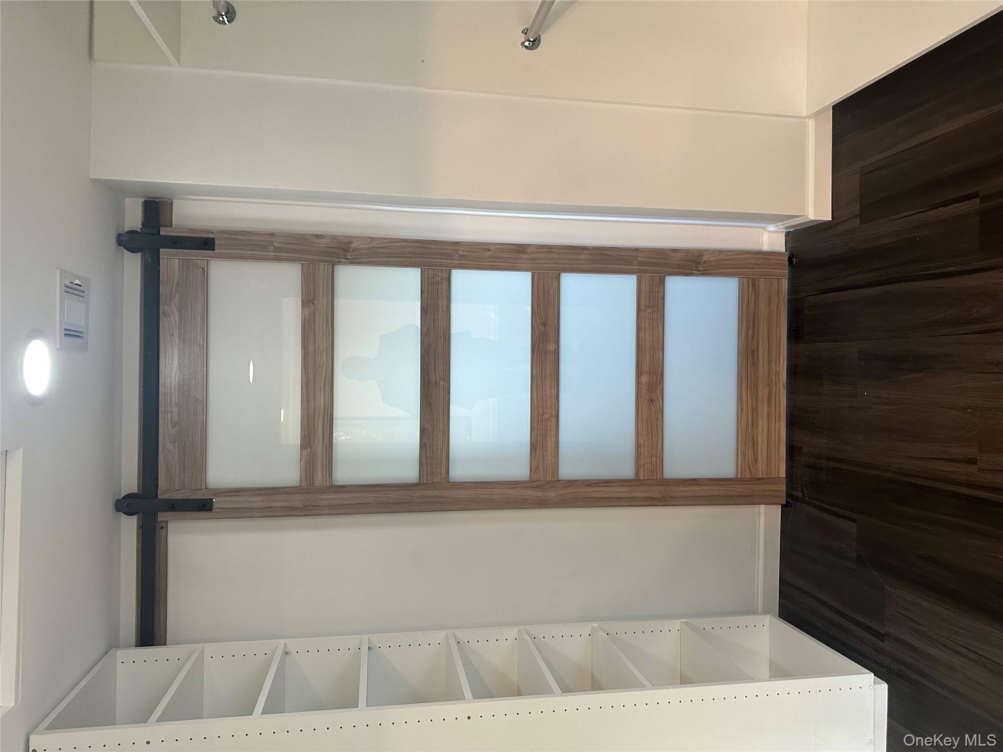 5918 Delafield Avenue Bronx, NY 10471 - Photo 17 of 31 a view of walk in closet with empty racks