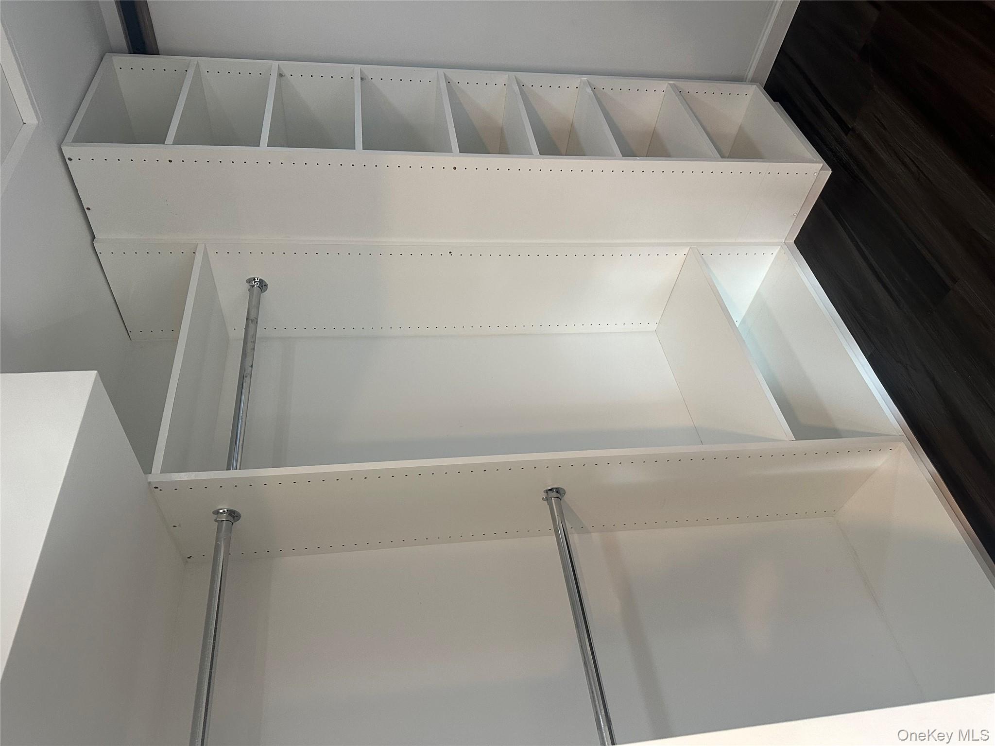 5918 Delafield Avenue Bronx, NY 10471 - Photo 18 of 31 a view of walk in closet with empty racks