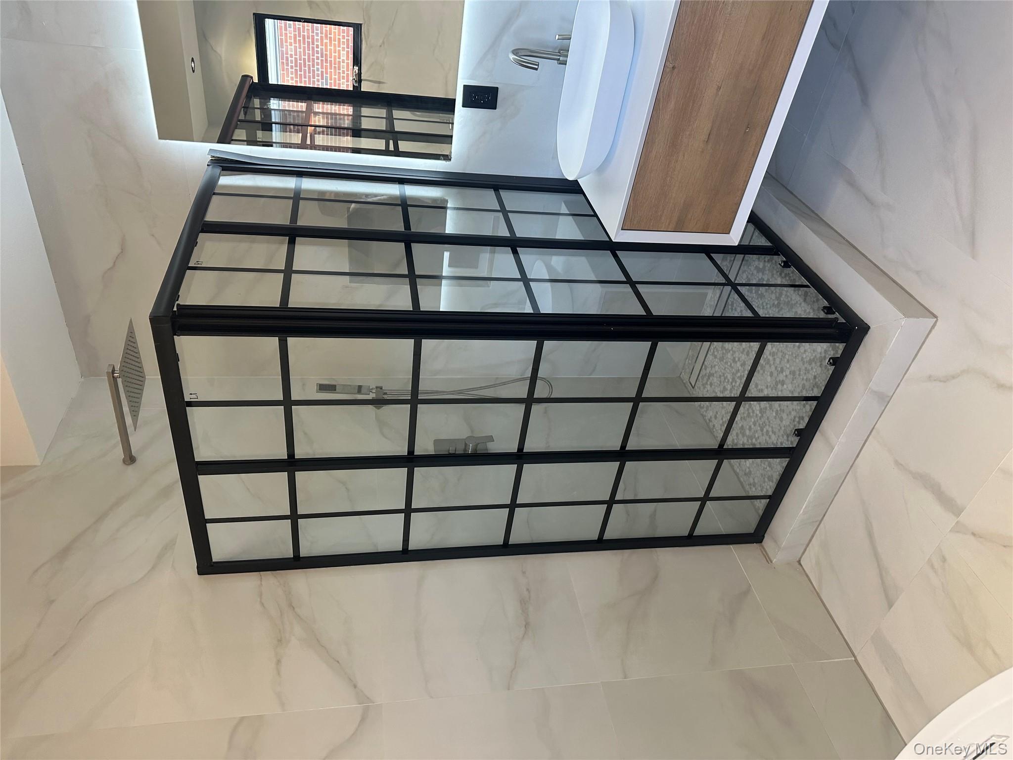 5918 Delafield Avenue Bronx, NY 10471 - Photo 20 of 31 a spacious bedroom with a balcony a bed and a window