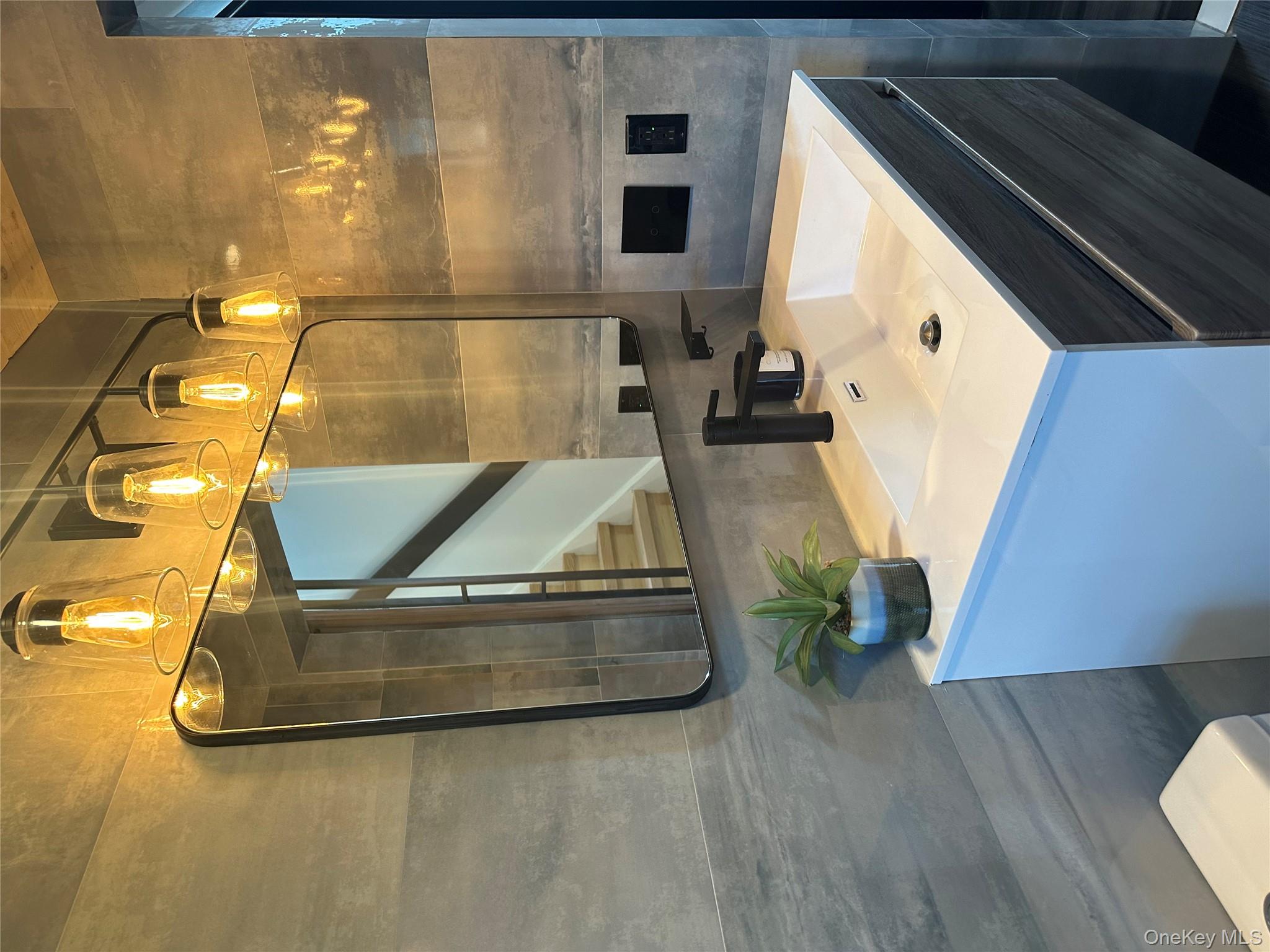 5918 Delafield Avenue Bronx, NY 10471 - Photo 23 of 31 a bathroom with a sink a toilet and mirror