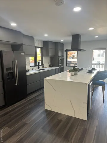 a stove top oven sitting inside of a kitchen