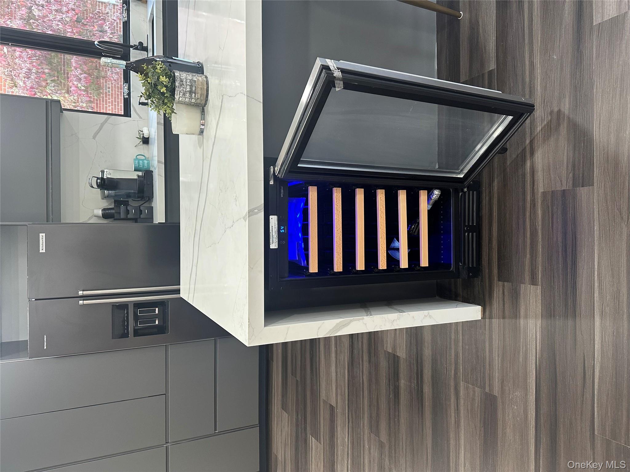 5918 Delafield Avenue Bronx, NY 10471 - Photo 10 of 31 a kitchen with a sink and a mirror