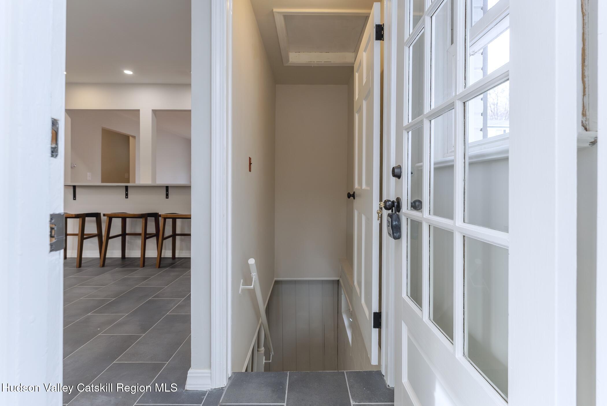 64 1st Avenue Kingston, NY 12401 - Photo 16 of 37 a view of a hallway with a dining table