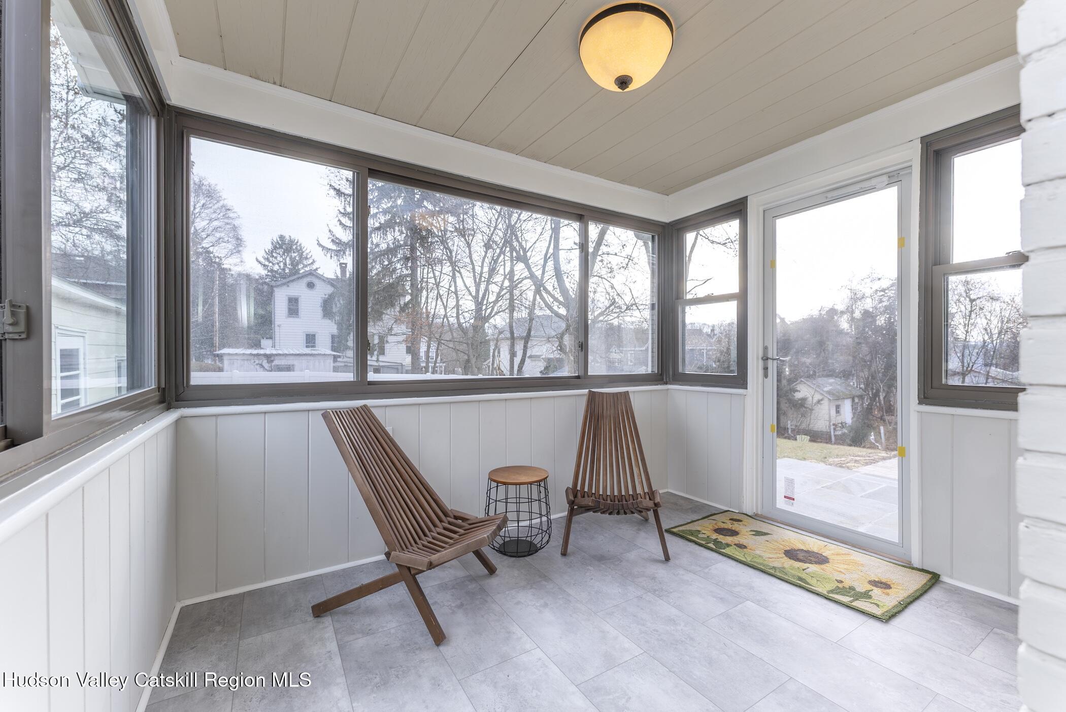 64 1st Avenue Kingston, NY 12401 - Photo 17 of 37 a view of a room with gym equipment and floor to ceiling window