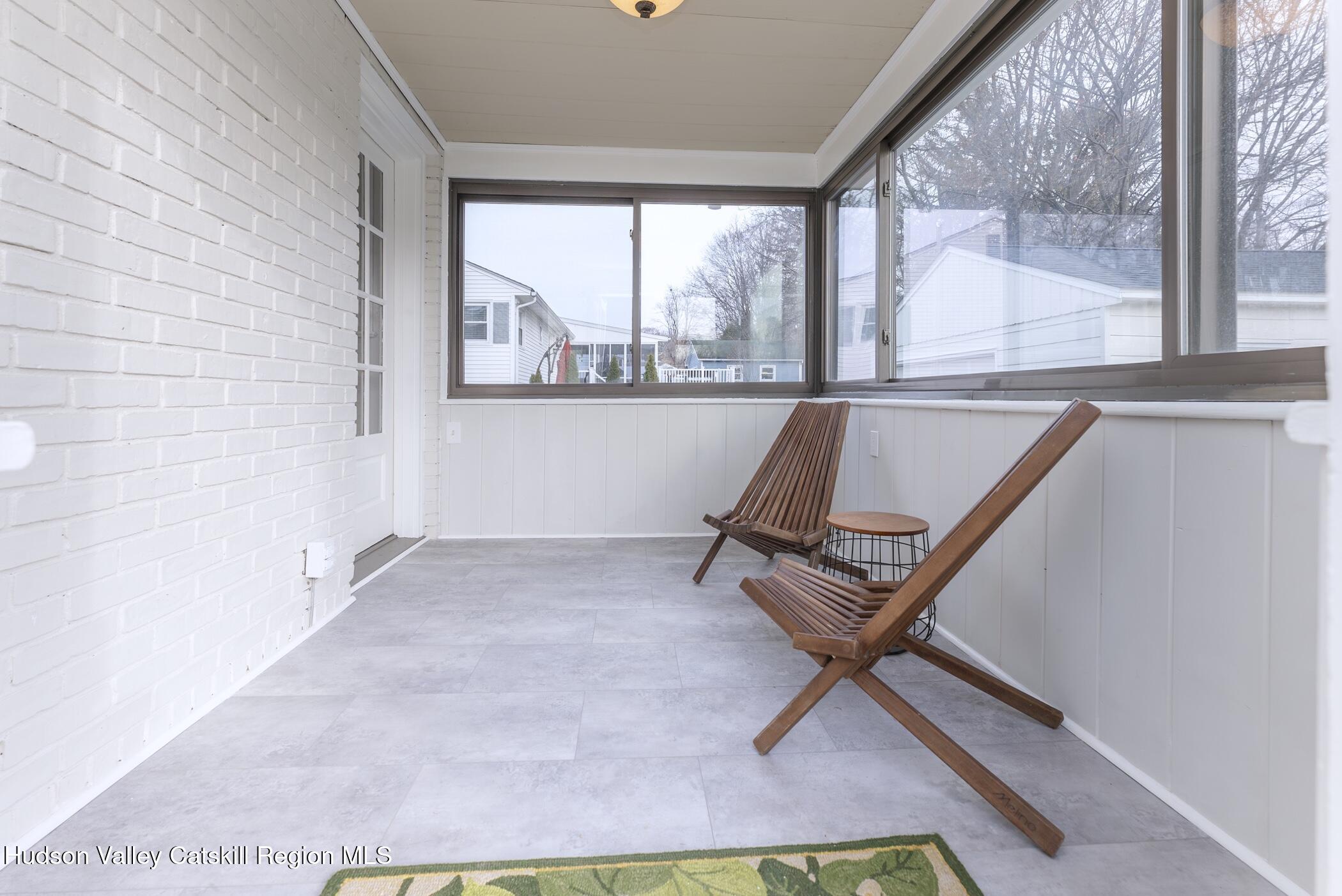 64 1st Avenue Kingston, NY 12401 - Photo 18 of 37 a living room with a couch and a floor to ceiling window