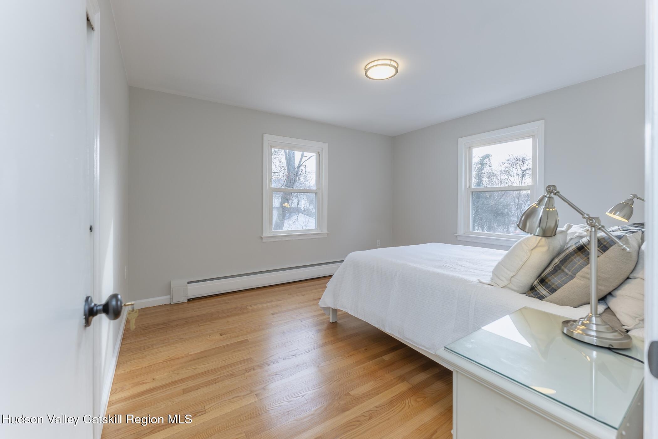 64 1st Avenue Kingston, NY 12401 - Photo 19 of 37 a living room with furniture and a window