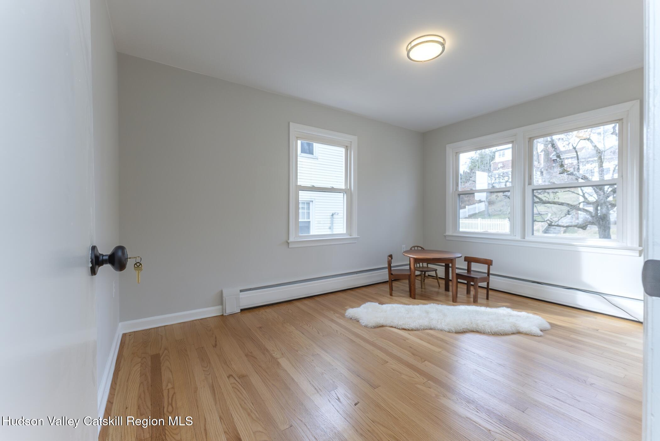 64 1st Avenue Kingston, NY 12401 - Photo 24 of 37 wooden floor in an empty room with a window