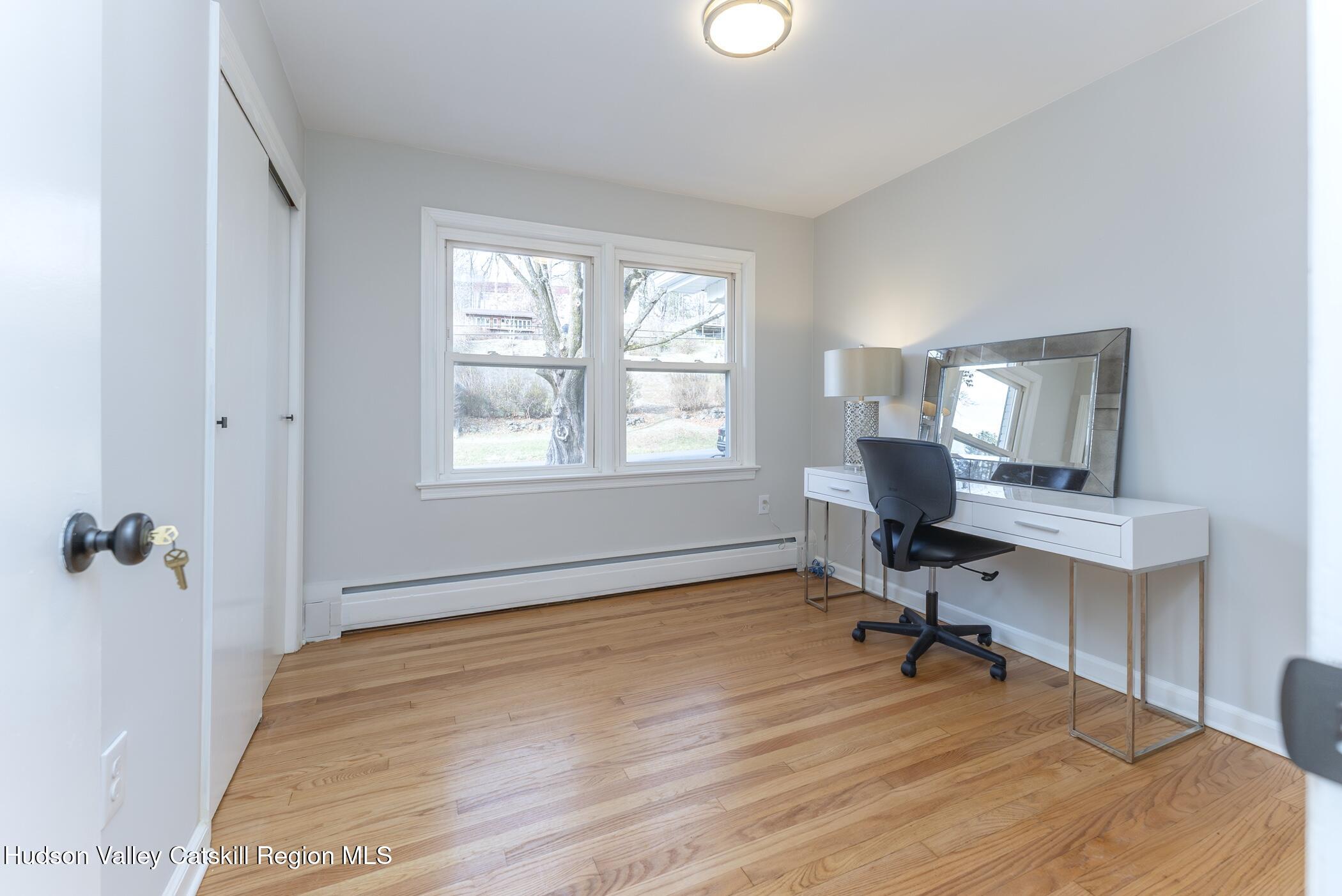 64 1st Avenue Kingston, NY 12401 - Photo 26 of 37 a view of a workspace with furniture and a window