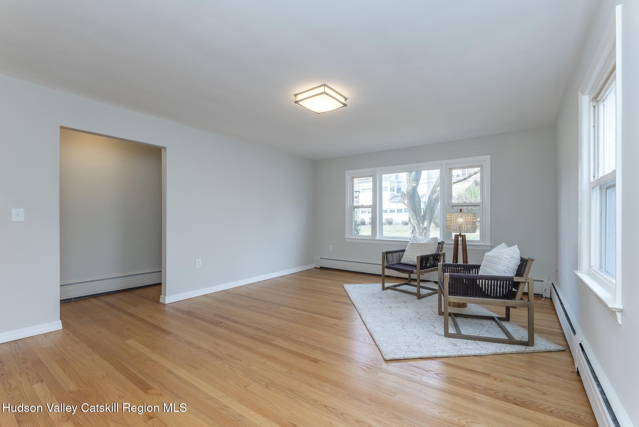 64 1st Avenue Kingston, NY 12401 - Photo 3 of 37 a living room with furniture and a window