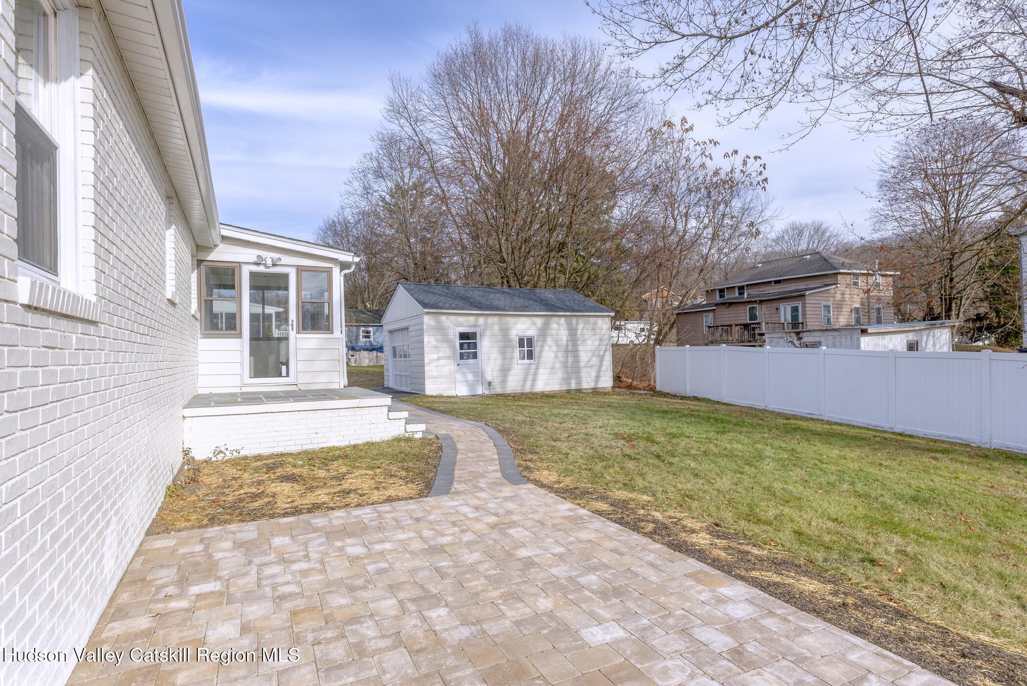 64 1st Avenue Kingston, NY 12401 - Photo 31 of 37 a view of a house with a yard covered in snow