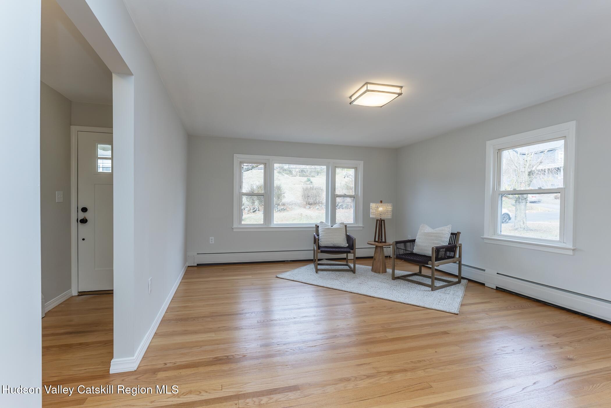 64 1st Avenue Kingston, NY 12401 - Photo 4 of 37 a living room with furniture and a wooden floor