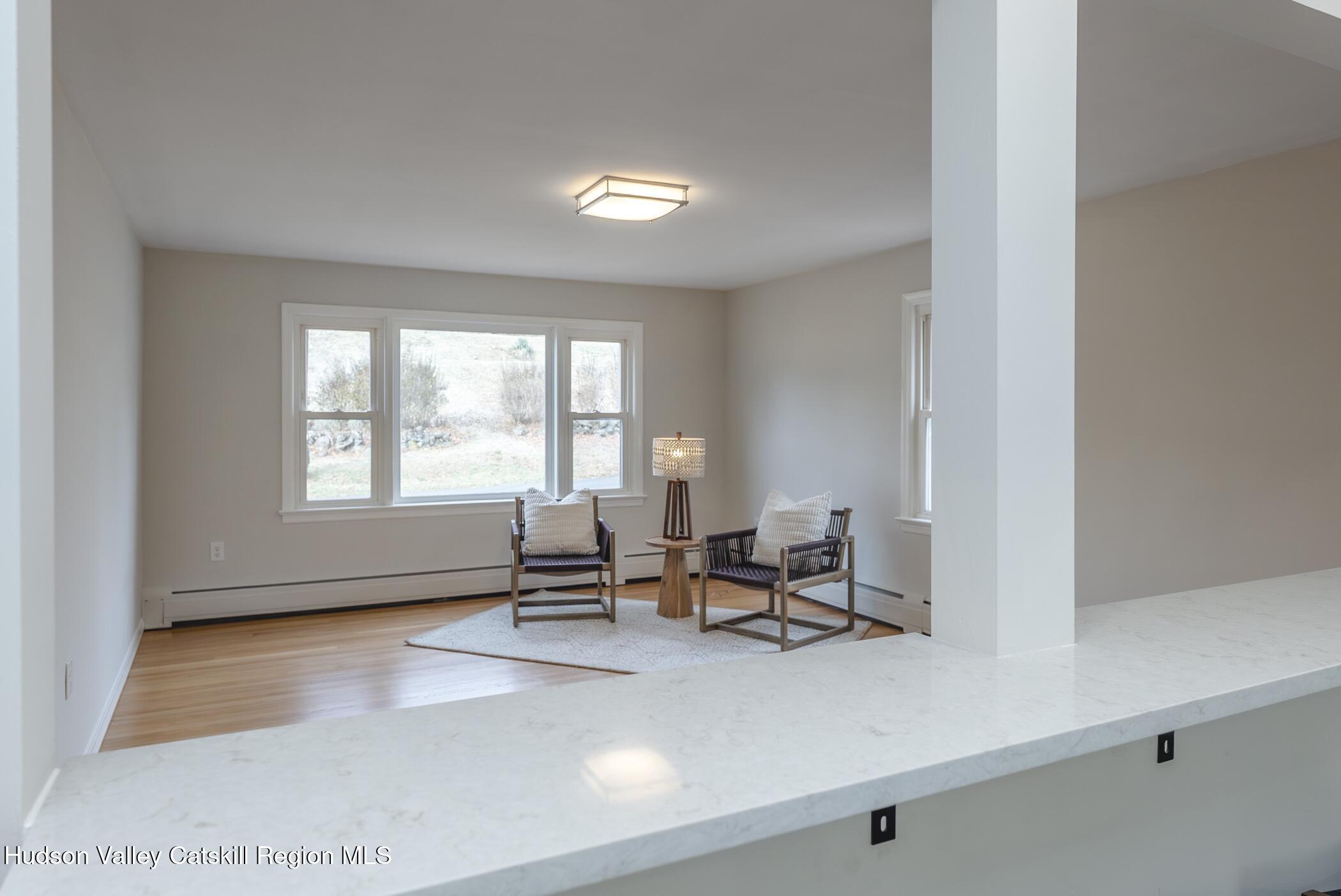 64 1st Avenue Kingston, NY 12401 - Photo 10 of 37 a view of a room with lounge chair and windows