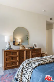 a bedroom with a bed and a dresser