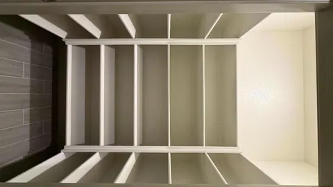 a view of a kitchen with wooden floor and a refrigerator