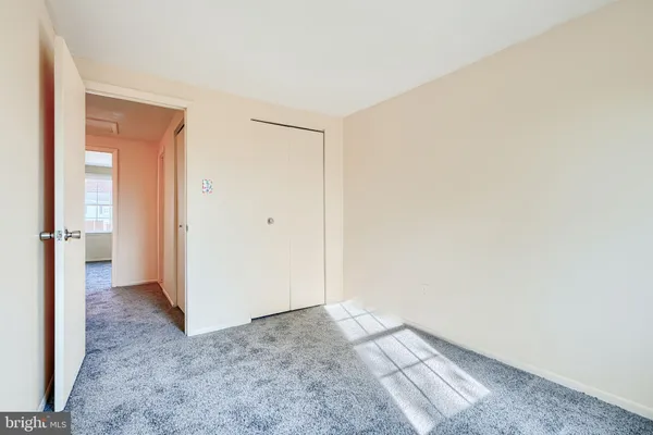 an empty room with a hallway